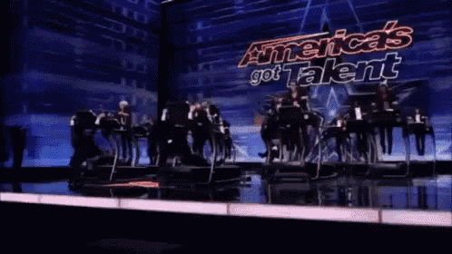 a group of people are riding treadmills on a stage with the words america 's got talent on the screen