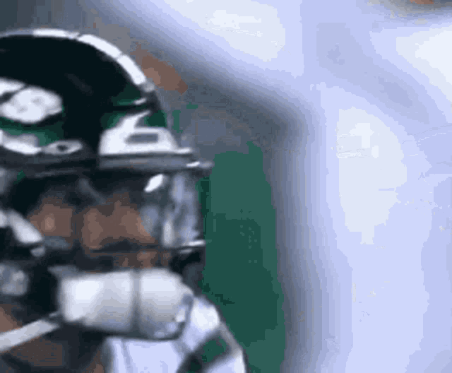 a close up of a football player wearing a helmet