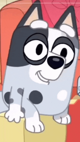 a cartoon dog is sitting on a couch and smiling at the camera .