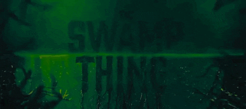 the word swamp thing is written on a green wall .