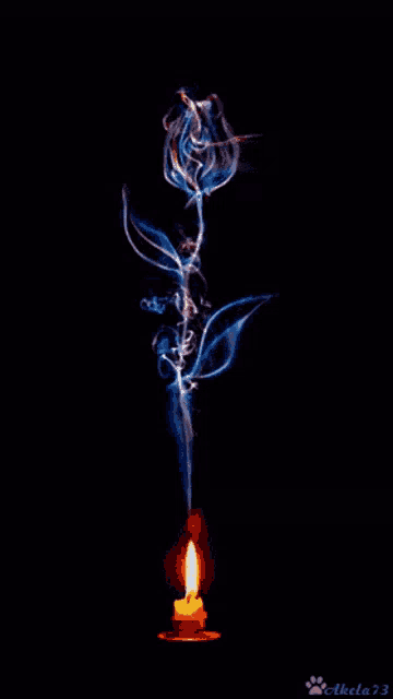 a candle with smoke coming out of it and the name akela73 on the bottom