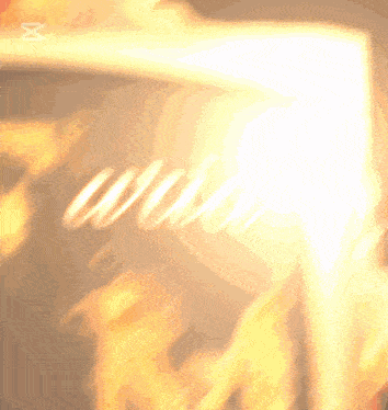 a blurred image of a fire with the letter x in the lower right corner