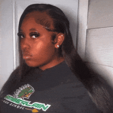 a woman wearing a shirt that says timberlain on it