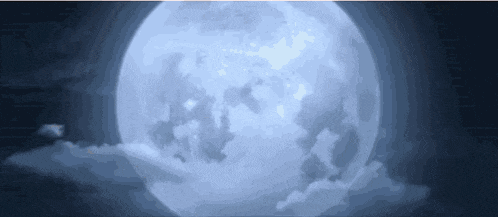 a full moon is surrounded by clouds in a dark night sky