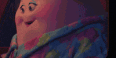 a close up of a woman 's stomach in a blue shirt