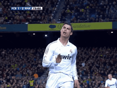 a soccer player wearing a white shirt with the word bwin on the front