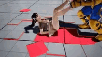 a person is laying on the ground with a red square on the ground