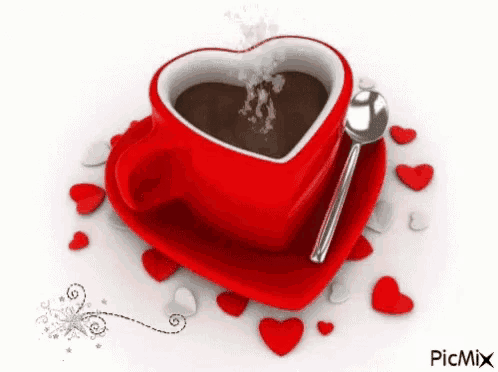 a heart shaped cup of coffee with a spoon in it surrounded by hearts .