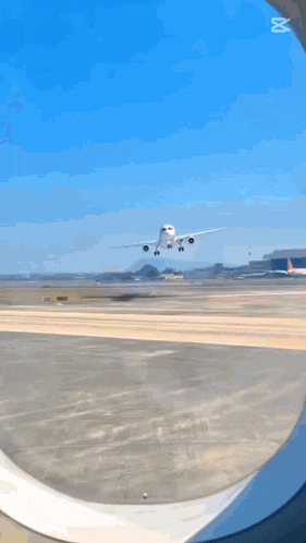 a white airplane is taking off from an airport runway and the caption says capcut