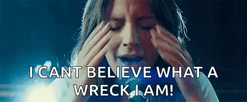 a woman is crying with her eyes closed and holding her head with her hands .