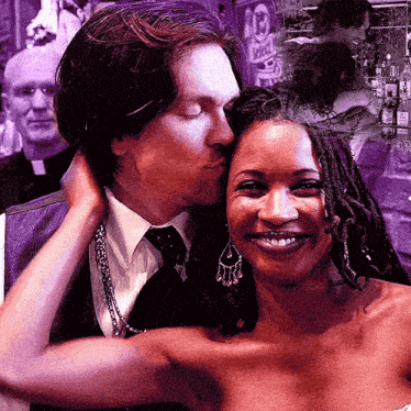 a man is kissing a woman on the cheek in front of a sign that says ' spirit '