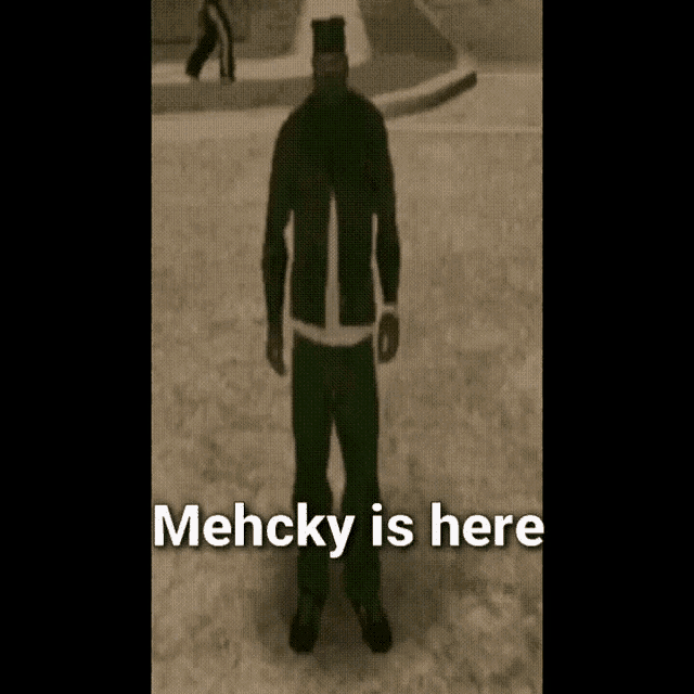 a man in a black jacket and green pants is standing in the snow with the words " mehcky is here " below him