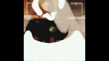 a blurred image of a person 's hand with a white outline
