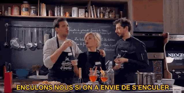 a group of people standing in a kitchen with the words enculons nous si on a envie de s'enculer