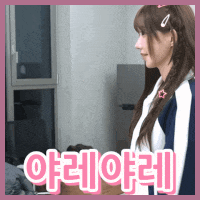 a girl with a star in her hair is standing in a room with the word hello in pink letters
