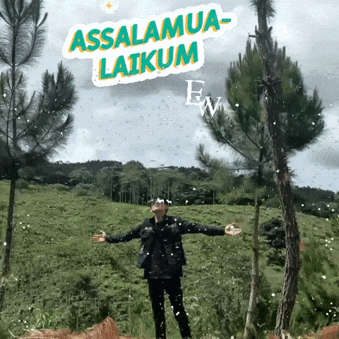 a man is standing in a field with his arms outstretched and a sticker that says assalamua-laikam