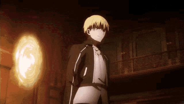 a man in a black jacket is standing in a dark room with a light behind him