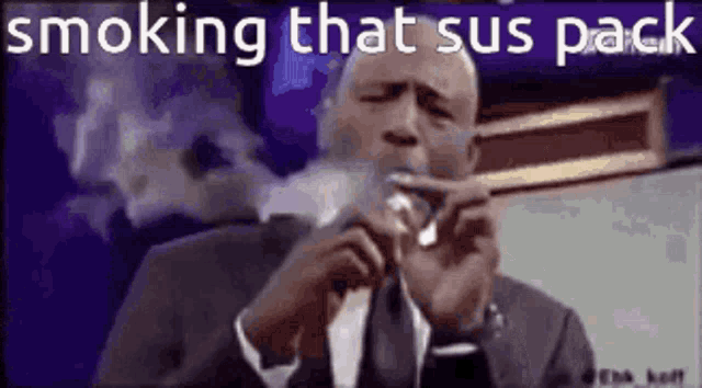 a man in a suit and tie is smoking a cigarette while giving a speech .