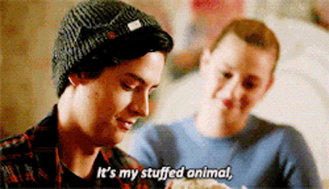 a man in a beanie says it 's my stuffed animal .