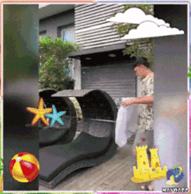 a man is standing on a deck holding a towel