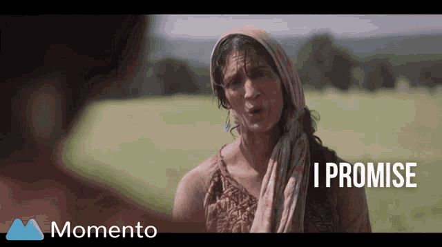 a woman with a scarf around her head says " i promise " in a momento ad