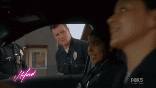 a group of police officers are sitting in a car with the words gotta go hybrid written on the screen