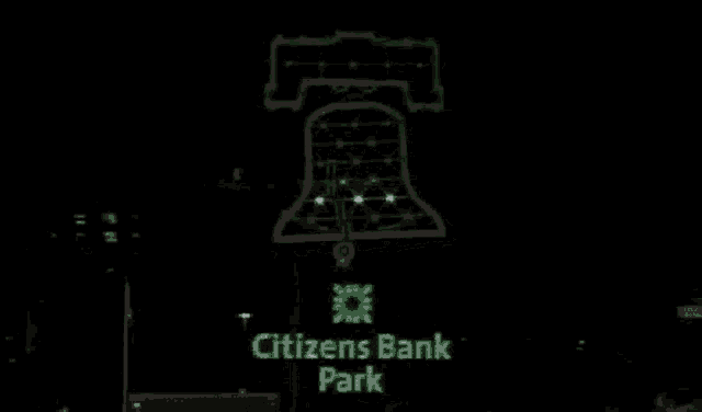 a drawing of a bell on a black background .