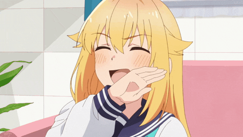 a girl with blonde hair is covering her face with her hand