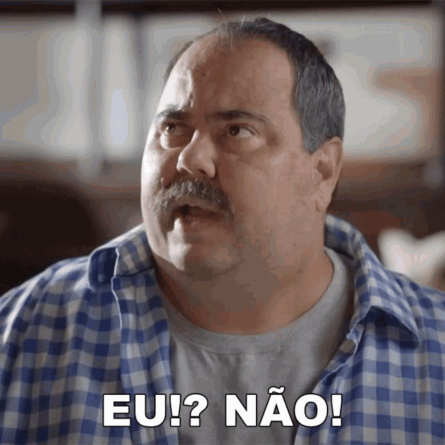 a man with a mustache and a plaid shirt says eu ? nao