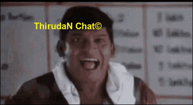 a man with a towel around his neck is screaming in front of a board that says thirudan chat