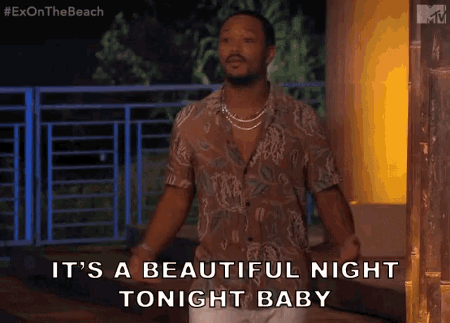 a man says it 's a beautiful night tonight baby while standing in front of a building