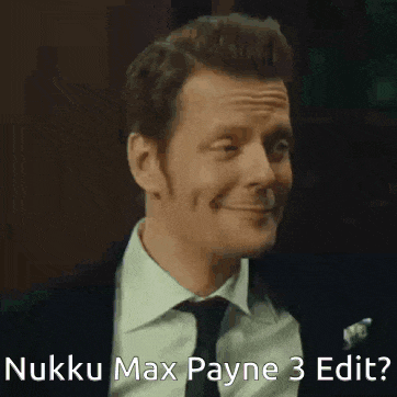 a man in a suit and tie is making a funny face and says nukku max payne 3 edit .