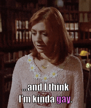 a woman is wearing a pink sweater and says " and i think i 'm kinda gay "