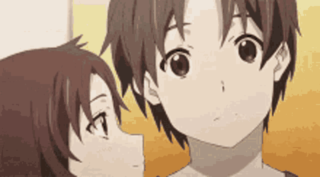 a boy and a girl are looking at each other in a cartoon .