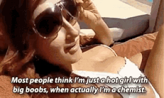a woman wearing sunglasses is laying on a couch and says most people think i 'm just a hot girl
