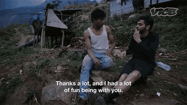 two men are sitting on a hillside and one of them says " thanks a lot "