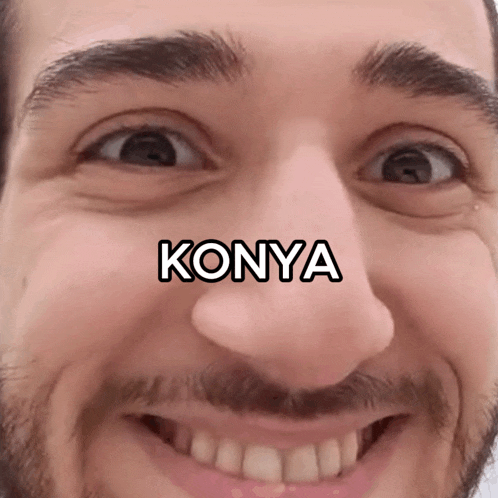a close up of a man 's face with the word konya written on it