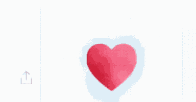 a red heart is floating in the air on a white background .