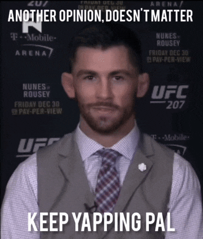 a man in a suit and tie is standing in front of a ufc 207 poster
