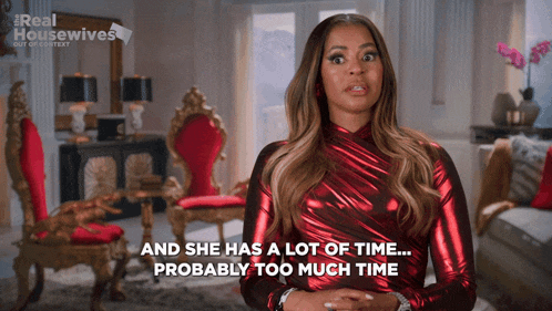 a woman in a red dress says " and she has a lot of time probably too much time "