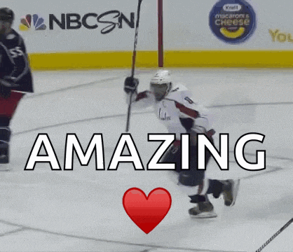 a hockey player is kneeling down on the ice with a heart in front of him that says amazing .