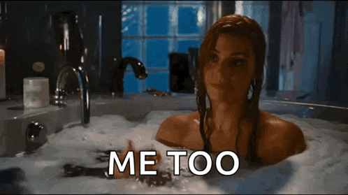 a woman is taking a bath in a bathtub with the words me too written on the bottom