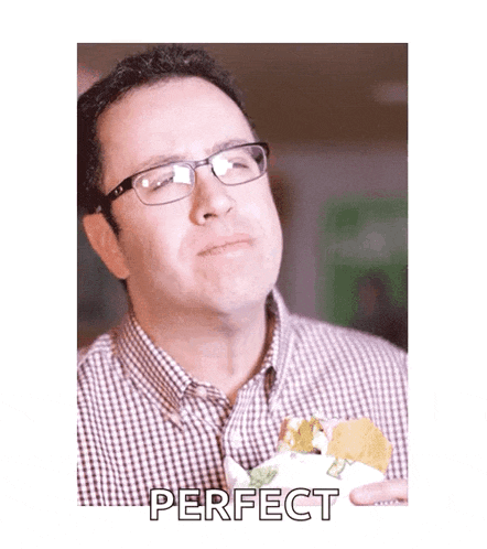 a man with glasses is eating a sandwich and the word perfect is on the bottom right