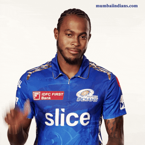 a man wearing a blue shirt that says slice on the front