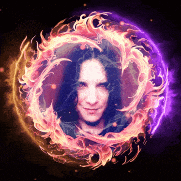 a man with long hair is surrounded by a circle of fire