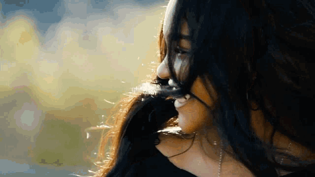 a close up of a woman with long hair