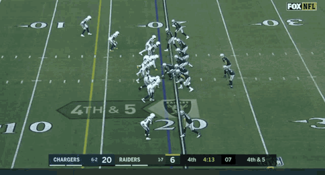 a football game is being played between the chargers and raiders