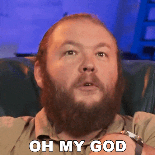 a man with a beard has the words oh my god on his face