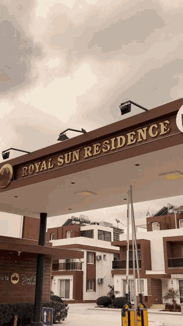a sign that says royal sun residence above a building