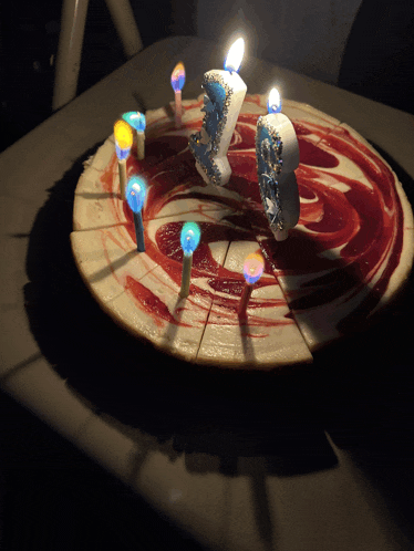 a birthday cake with candles in the shape of the number 1